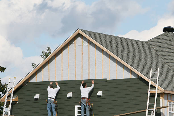 Professional Storm Damage Siding Repair technician working in Robbins, NC